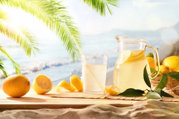 Travel-Perks is easy peasey to use. Picture of squeezed lemon juice being served on a tropical sandy beach